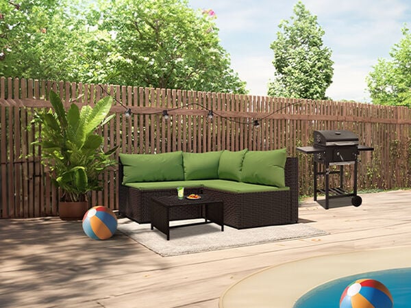 Sectional sofa with green cushions, coffee table, and BBQ grill by the pool in a styled backyard. Click to see the products in the collection.