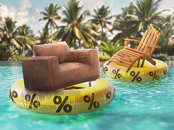 Clickable promotional banner showing a brown leather armchair and a wooden lounge chair floating on yellow inflatable rings with black percent signs, in a turquoise pool surrounded by palm trees.
