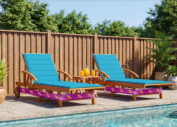 Two wooden poolside loungers with blue cushions beside a swimming pool, surrounded by potted plants. 