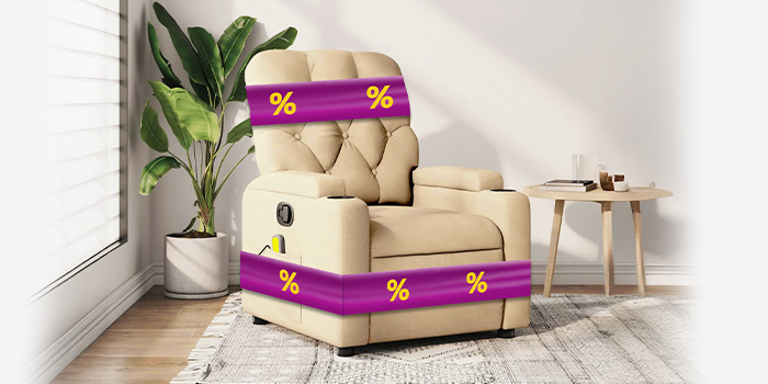 Beige recliner chair with purple promotional bands showing yellow discount icons, next to side table and potted plant, in a styled living room. Click to shop the collection.