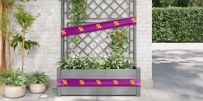 Gray garden planter box with trellis and plants, with purple bands displaying yellow discount icons.