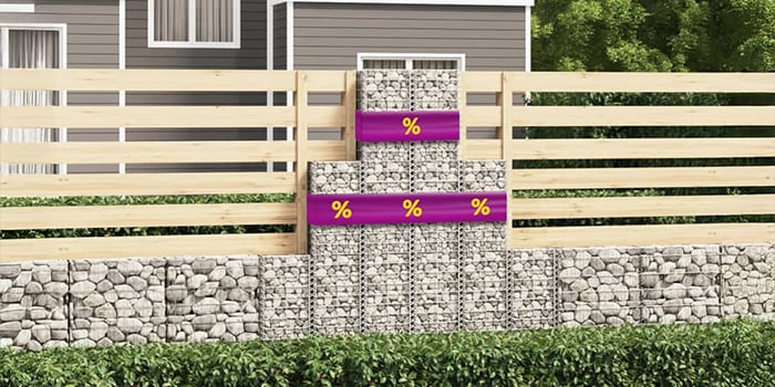 Metal fence gate with purple bands displaying yellow discount icons in a garden setting.