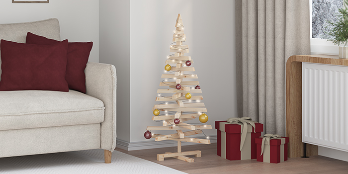 Minimal wooden Christmas tree with lights and ornaments beside wrapped gifts. Click to see the products in the collection.