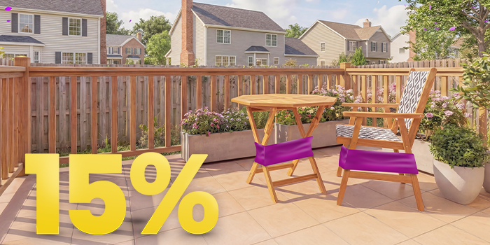 Outdoor wooden patio table and chair with purple sale bands displayed on a sunny terrace, featuring a prominent 15% discount message. Click to see the products in the collection.